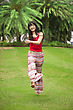 Beautiful Young Woman Running On The Green Field