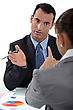 Stock Photo : Conference Table Stock Photo: Businessman And Businesswoman Having A Discussion