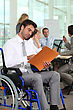 Stock Photo : Bearded Dragon Stock Photography: Group Of Business People In A Meeting Room, One Of Them In A Wheelchair.