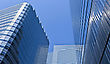Stock Photo : Downtown Stock Image: Intentional Distortion Abstract Low Angle View At Modern Corporate Buildings In Perspective With Blue Sky Reflection