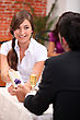 Man Giving A Woman A Gift In A Restaurant