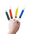 Stock Photo : Cure Stock Photo: Medical Syringes With Colored Liquid In His Hand