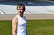 Stock Photo : Aerobics Stock Photo: Portrait Of Athletic Male Against Empty Sport Stadium