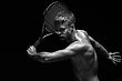 Stock Photo : Exercise Stock Photo: Portrait Of A Tanned Sportive Tennis Player With A Racket Against Black Background