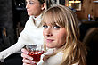 Stock Photo : Friends Pictures: Two Female Friends Relaxing At Home With Glass Of Wine